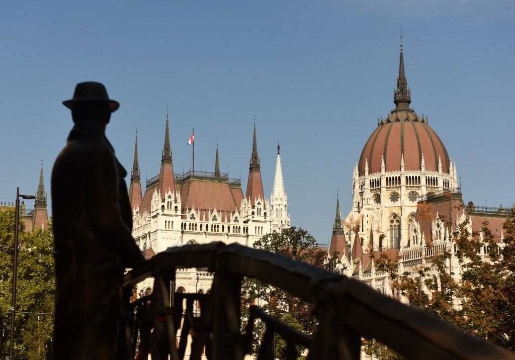 Statue of Imre Nagy, hero of the 1956 Uprising, and the Parliament Building in Budapest, Hungary